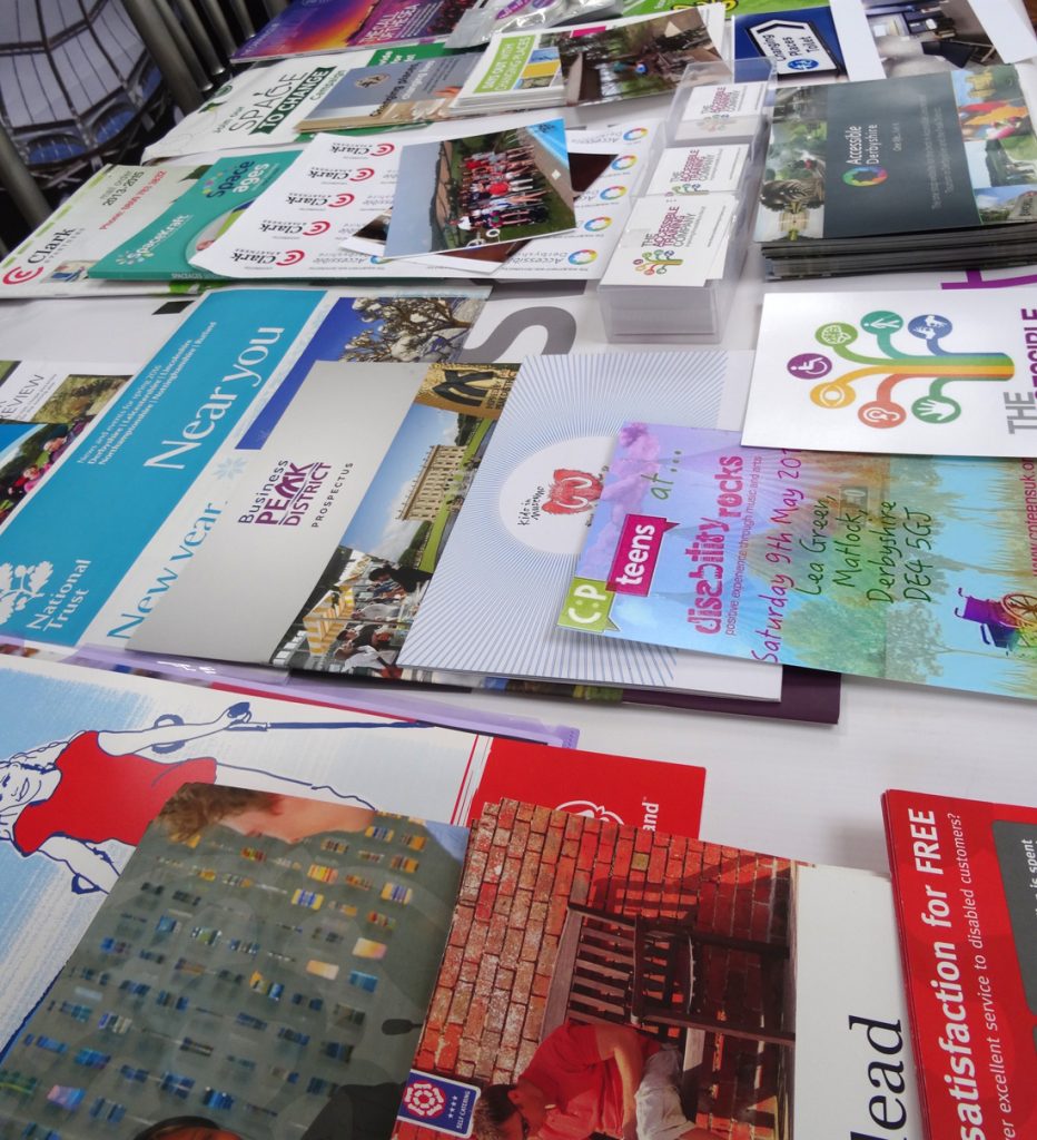 An array of marketing materials promoting accessibility services.
